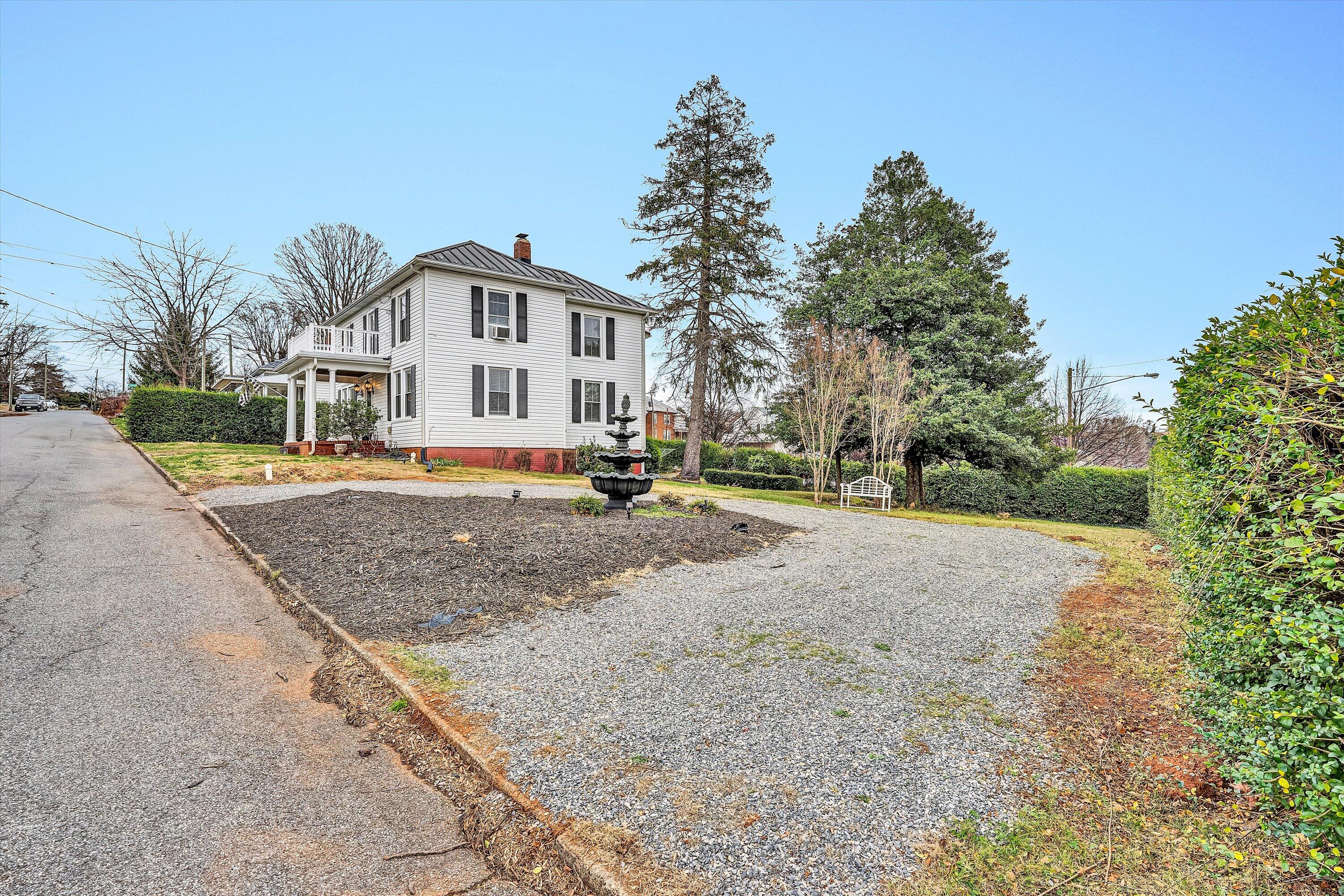 40 High Street Rocky Mount, VA 24151 - Photo 34 of 36 a front view of a house with a yard and trees