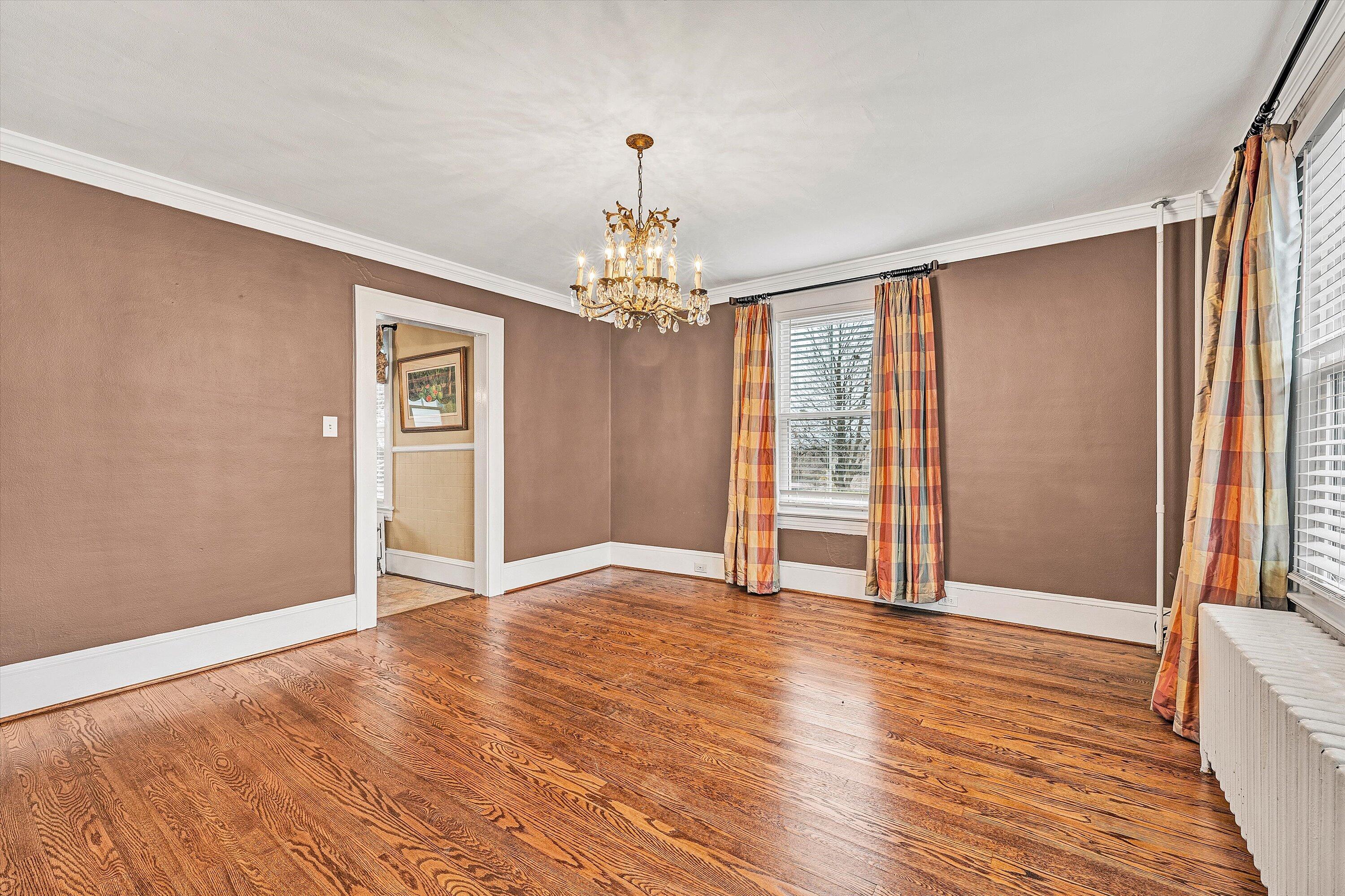 40 High Street Rocky Mount, VA 24151 - Photo 7 of 36 a view of an empty room with wooden floor and a window