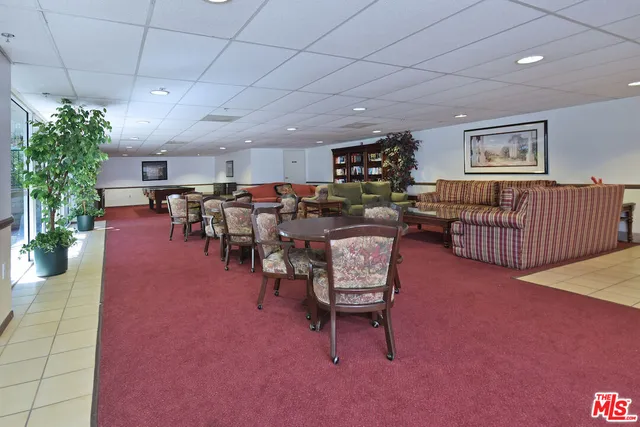 a living room with lots of furniture and a chandelier
