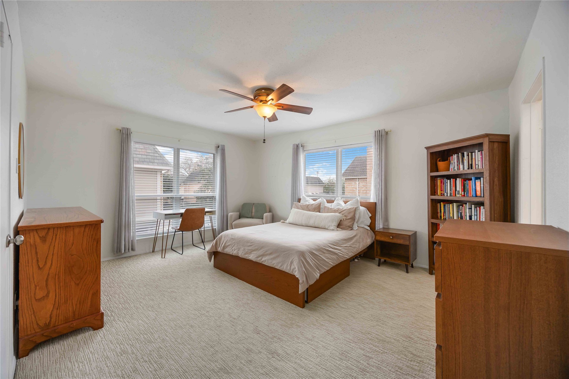 2230 South Piney Point Road, Unit 206 Houston, TX 77063 - Photo 12 of 24 The spacious primary bedroom has large windows that provide amazing natural lighting into the space.