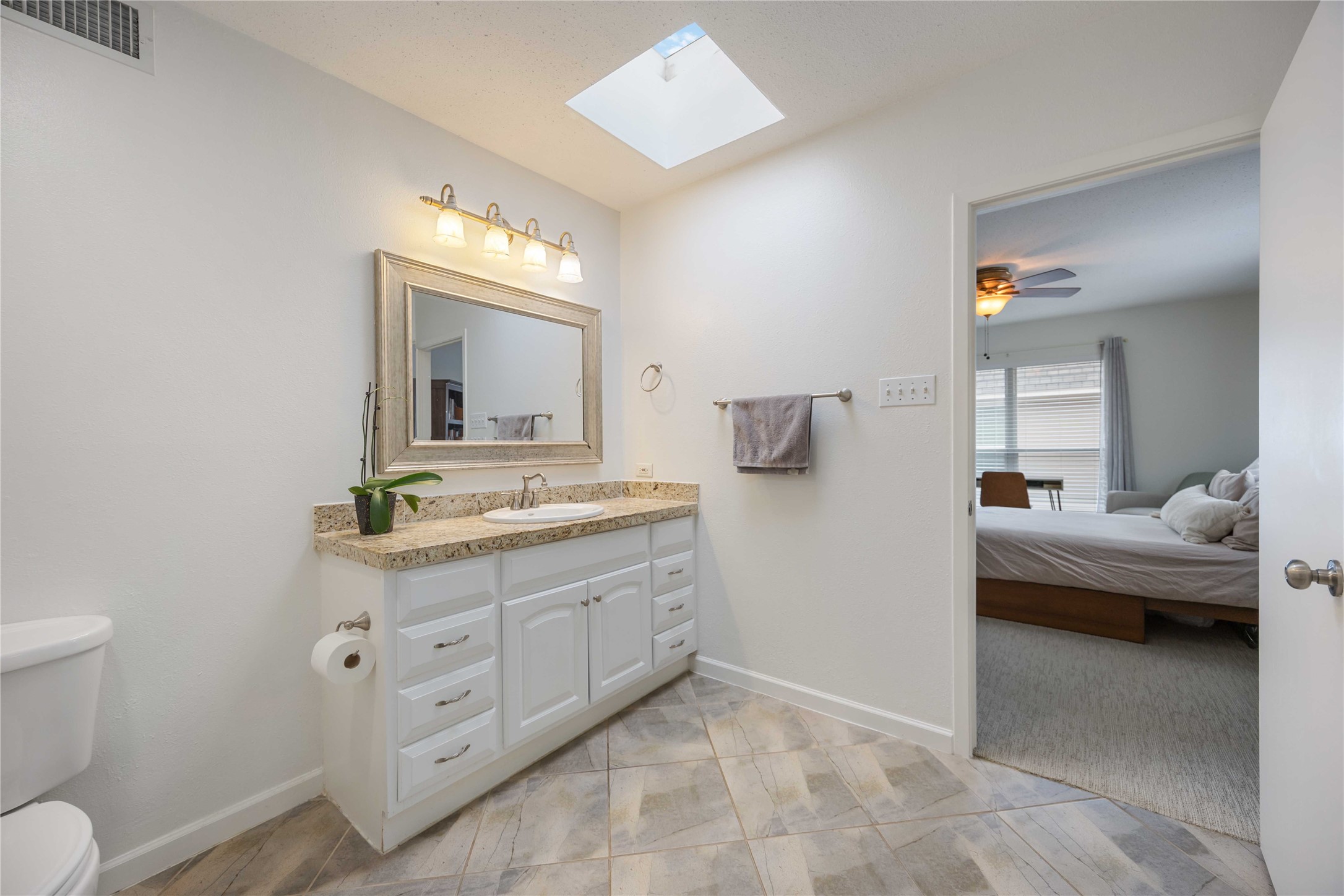 2230 South Piney Point Road, Unit 206 Houston, TX 77063 - Photo 16 of 24 The sun window provides natural lighting to the primary bathroom.