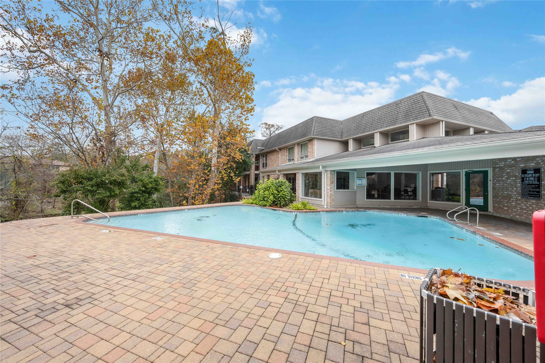 2230 South Piney Point Road, Unit 206 Houston, TX 77063 - Photo 22 of 24 The property includes access to a community pool and clubhouse.