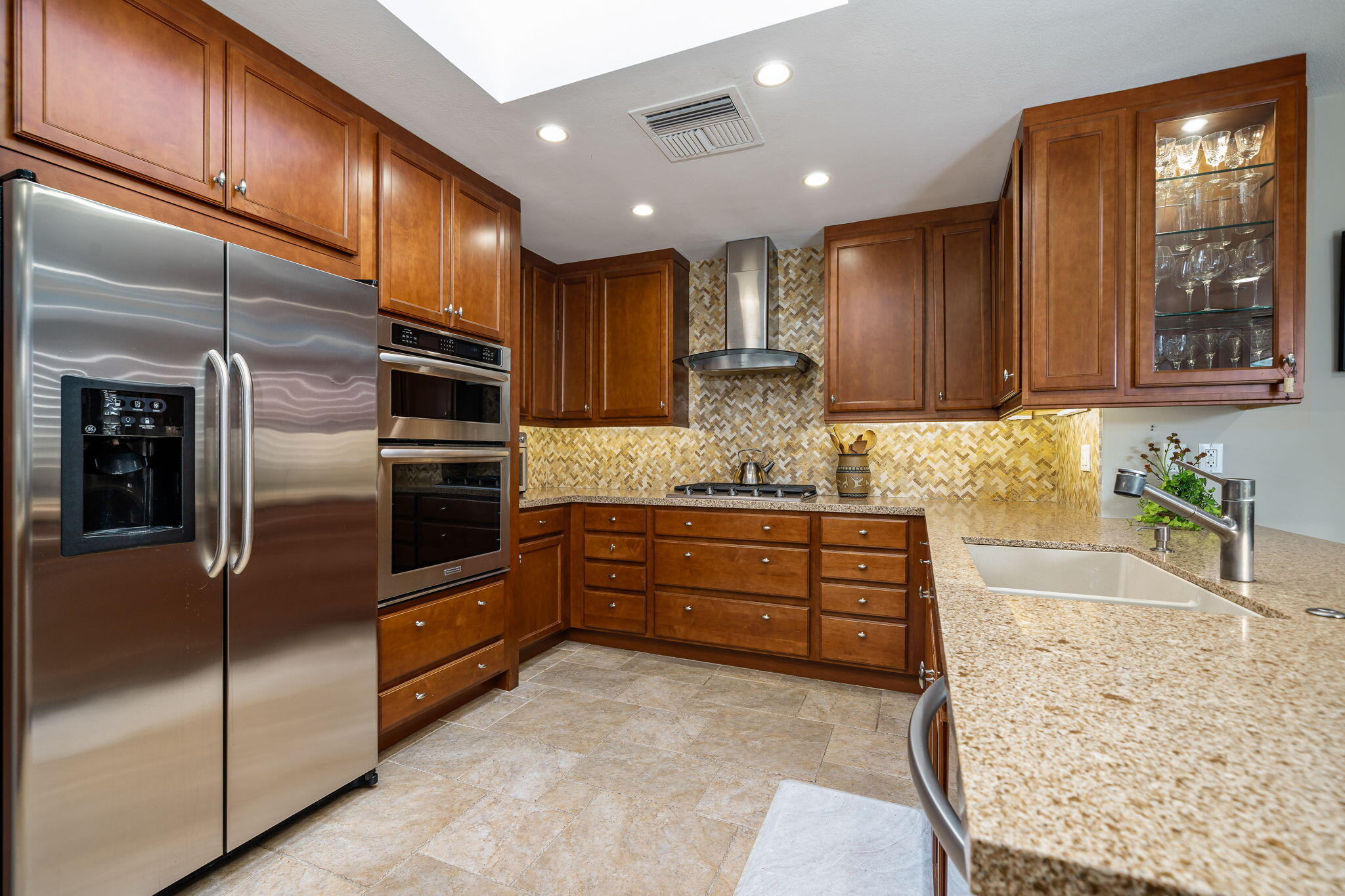 3 Tulane Court Rancho Mirage, CA 92270 - Photo 16 of 47 a kitchen with stainless steel appliances granite countertop a refrigerator a stove and a sink