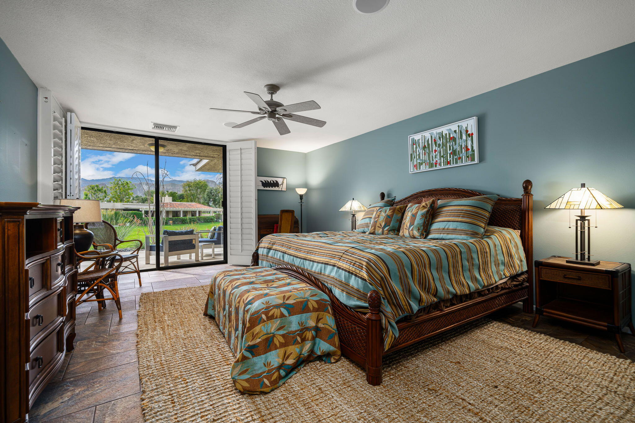 3 Tulane Court Rancho Mirage, CA 92270 - Photo 21 of 47 a bedroom with a large bed and a large window