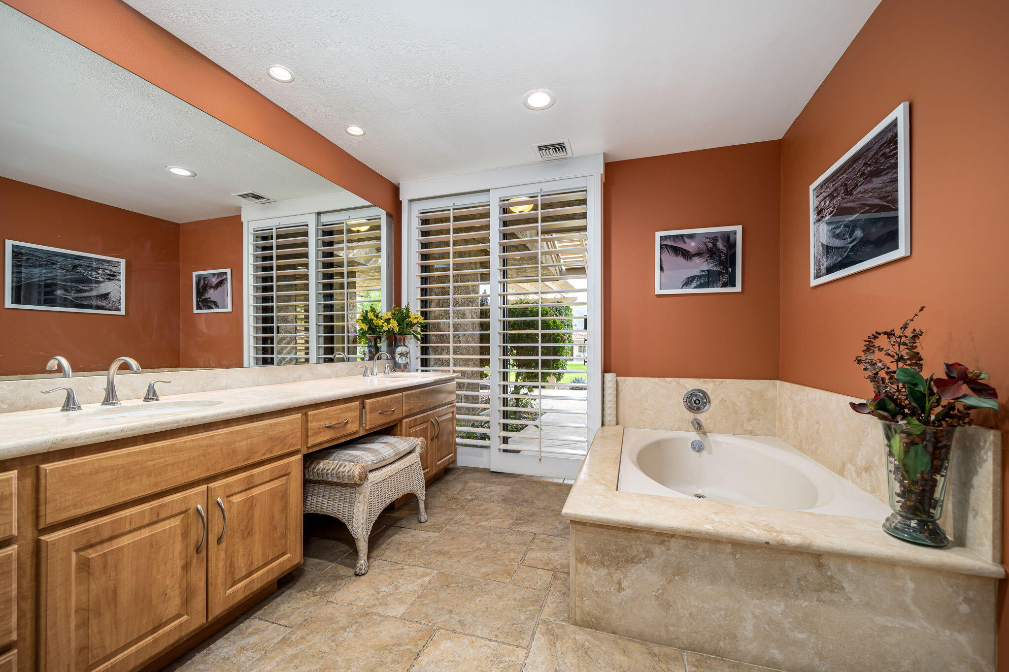 3 Tulane Court Rancho Mirage, CA 92270 - Photo 23 of 47 a spacious bathroom with a granite countertop tub sink and mirror
