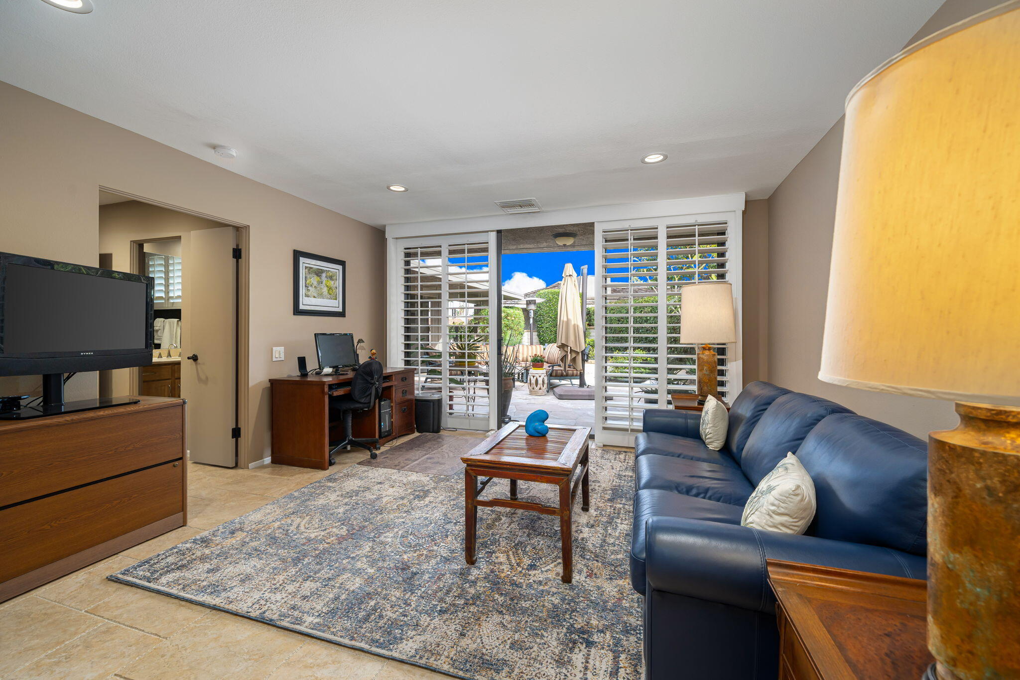 3 Tulane Court Rancho Mirage, CA 92270 - Photo 27 of 47 a living room with furniture and a flat screen tv