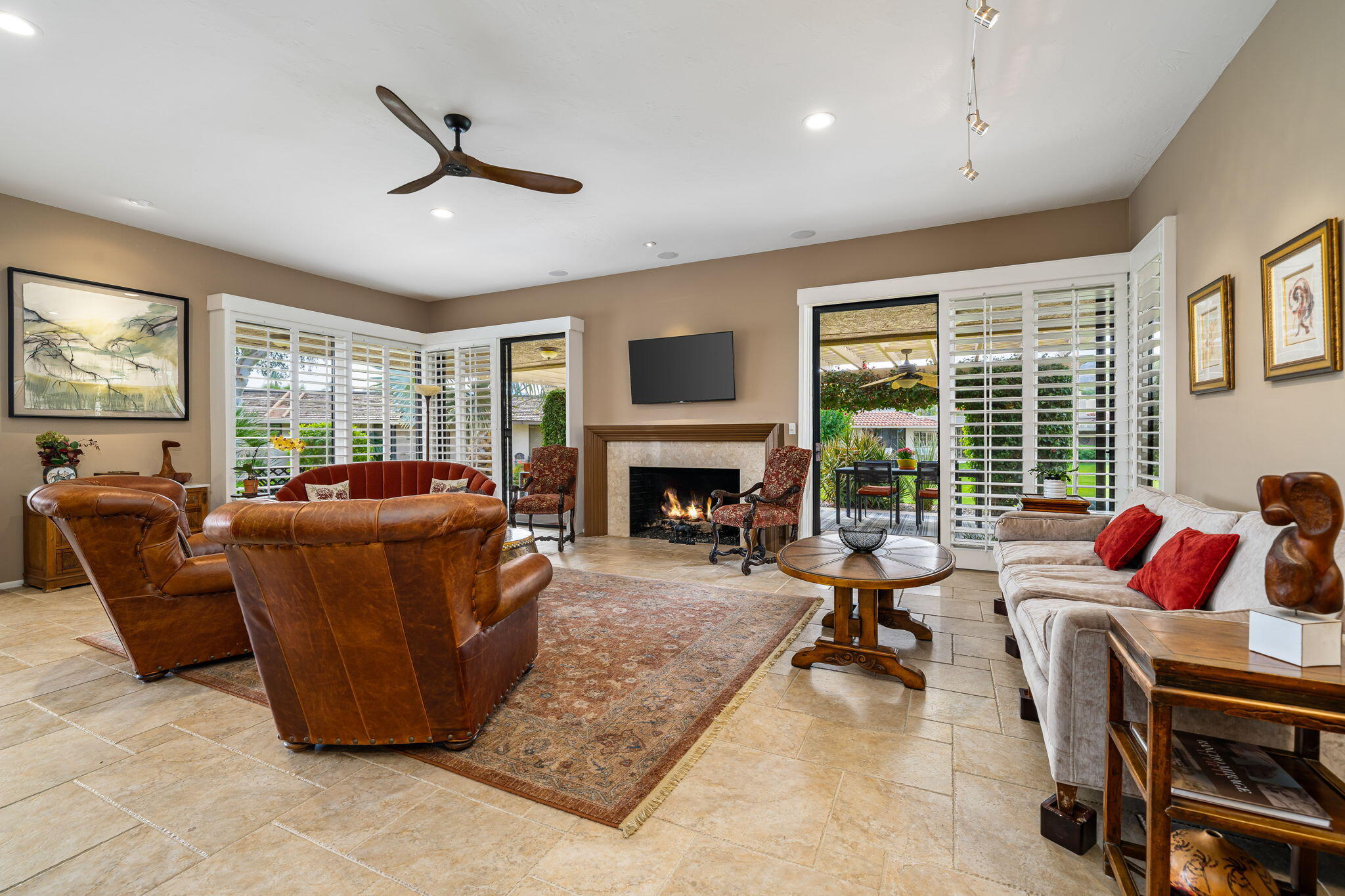 3 Tulane Court Rancho Mirage, CA 92270 - Photo 4 of 47 a living room with furniture large window and a fireplace