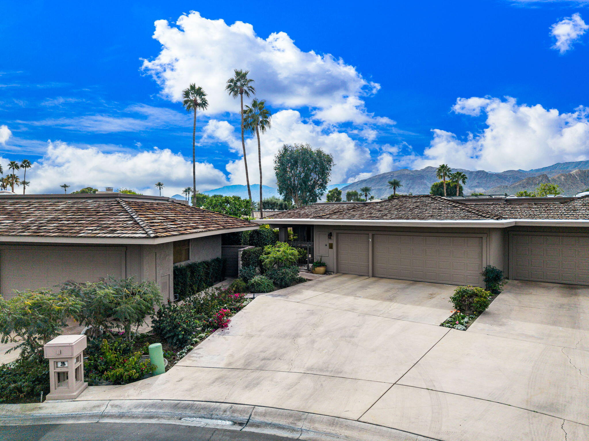 3 Tulane Court Rancho Mirage, CA 92270 - Photo 42 of 47 a view of a house with a flower garden