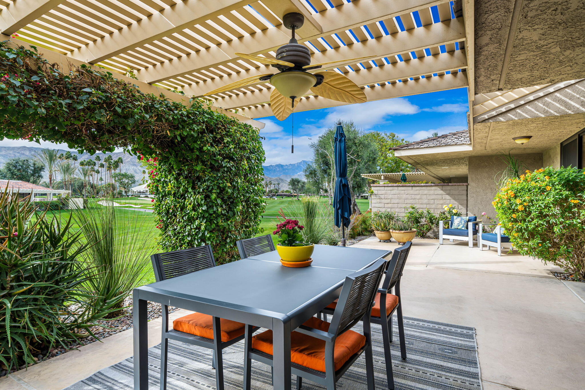 3 Tulane Court Rancho Mirage, CA 92270 - Photo 8 of 47 a view of a patio with table and chairs and potted plants