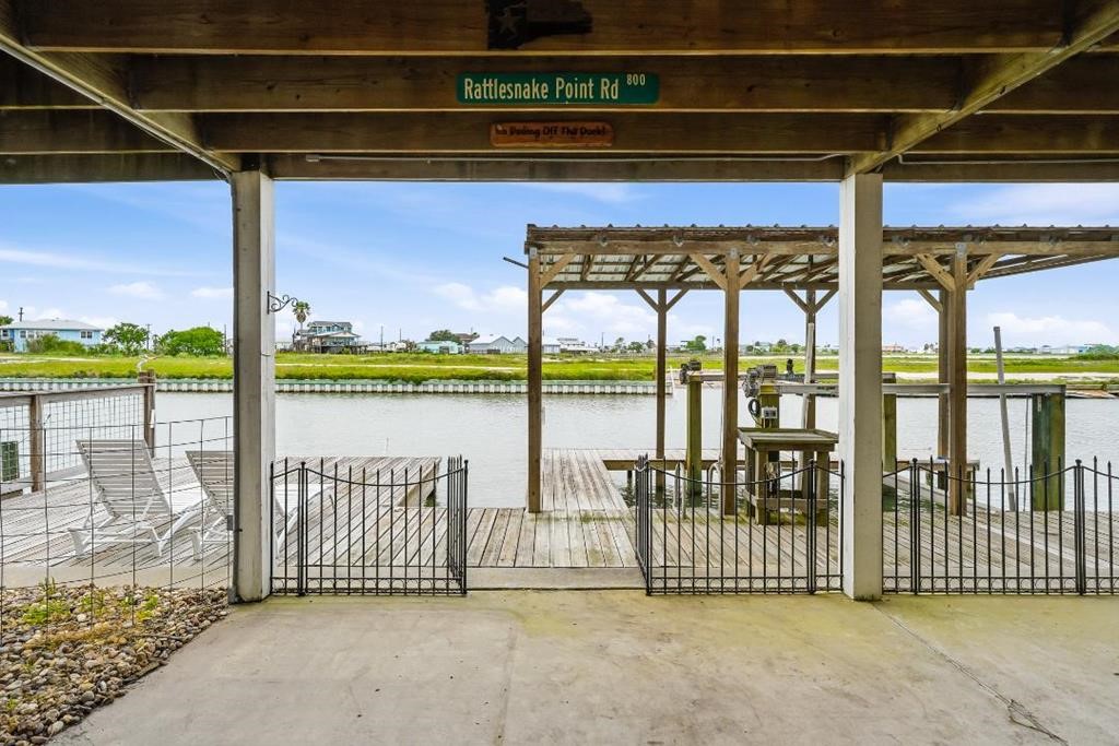 838 Rattlesnake Point Road Rockport, TX 78382 - Photo 34 of 40 a view of a balcony with a floor to ceiling window next to a yard