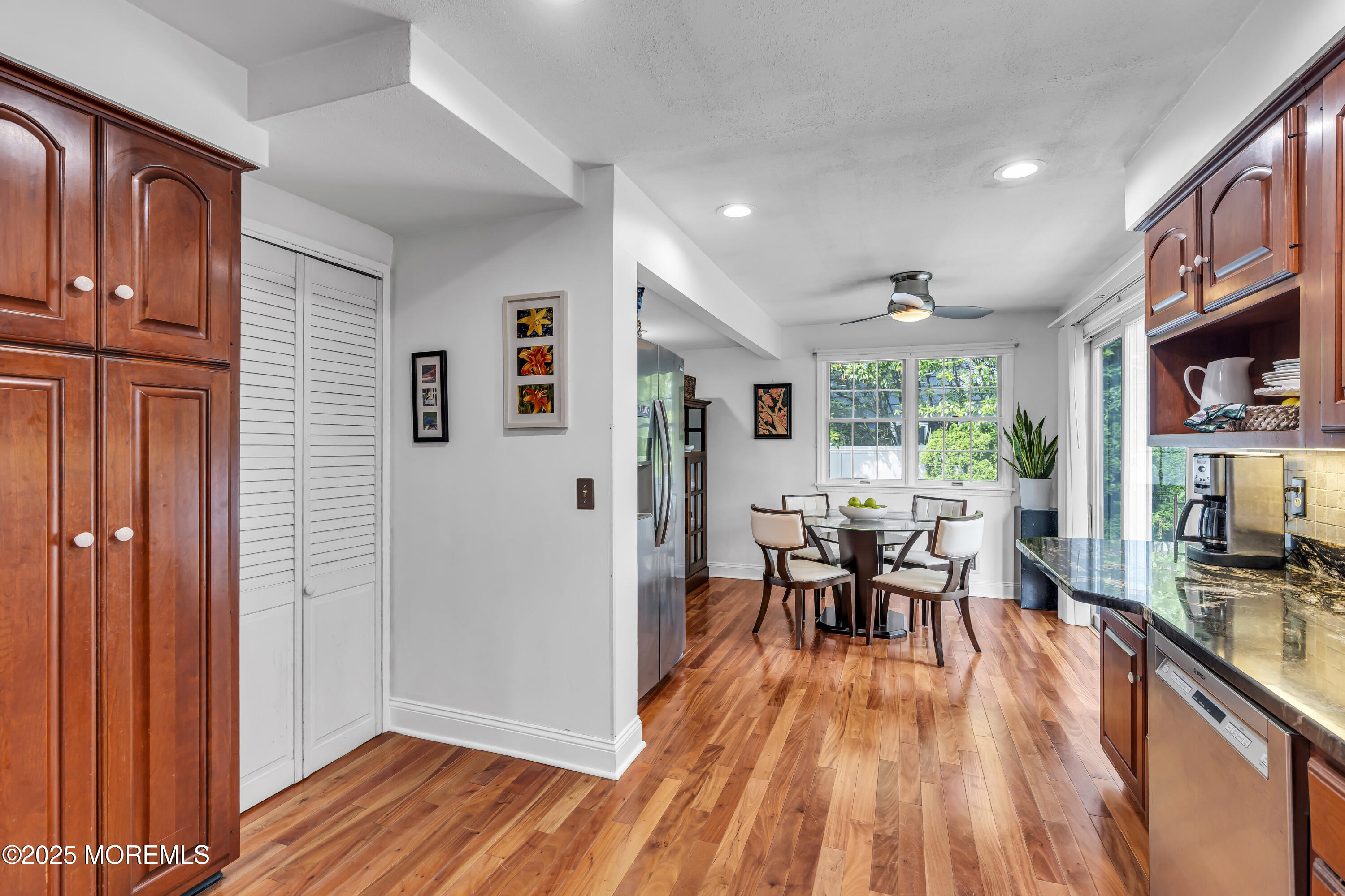 82 Ridge Road Fair Haven, NJ 07704 - Photo 15 of 39 a dining room with stainless steel appliances granite countertop furniture wooden floor and a window