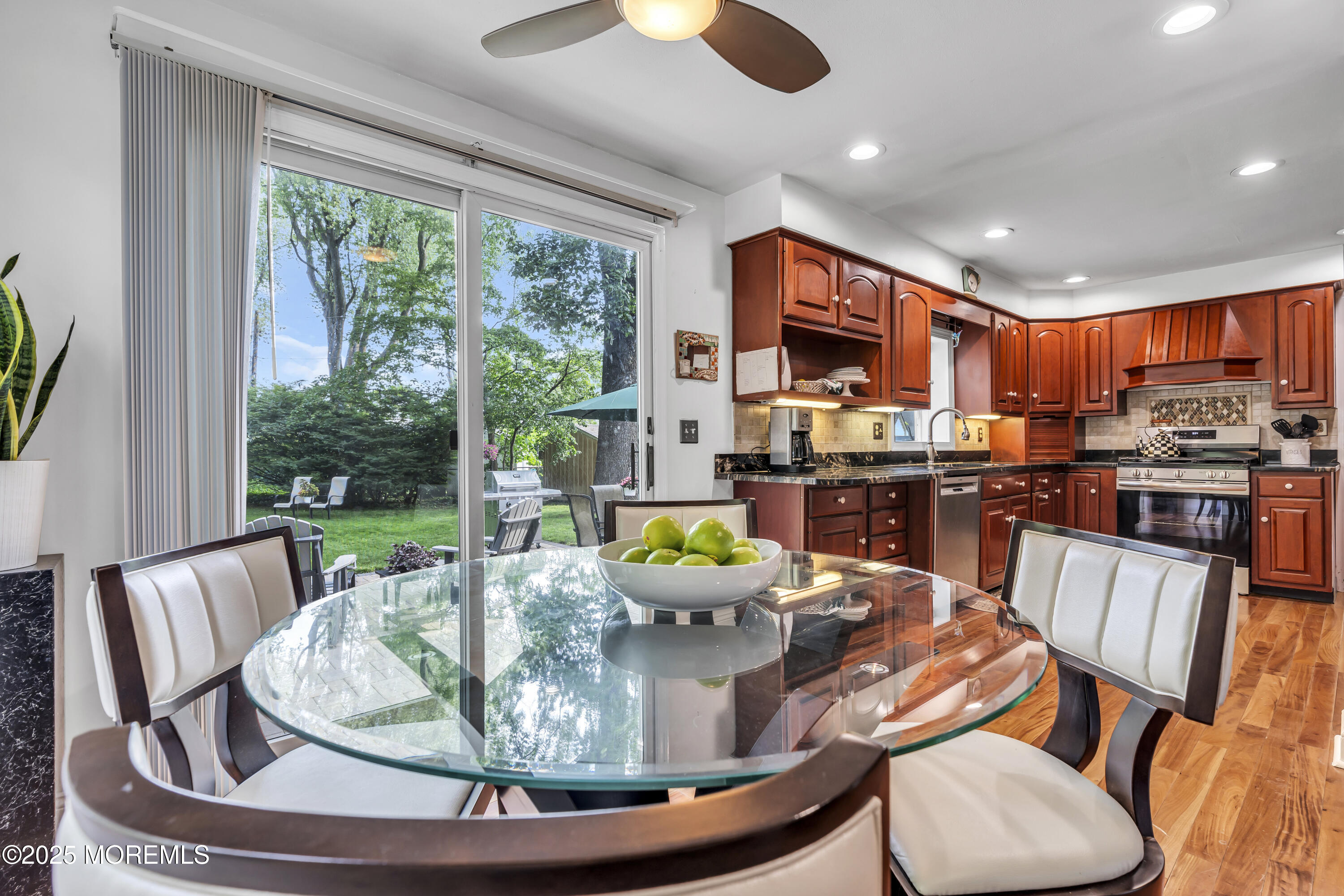82 Ridge Road Fair Haven, NJ 07704 - Photo 18 of 39 a dining room with furniture a large window and kitchen view