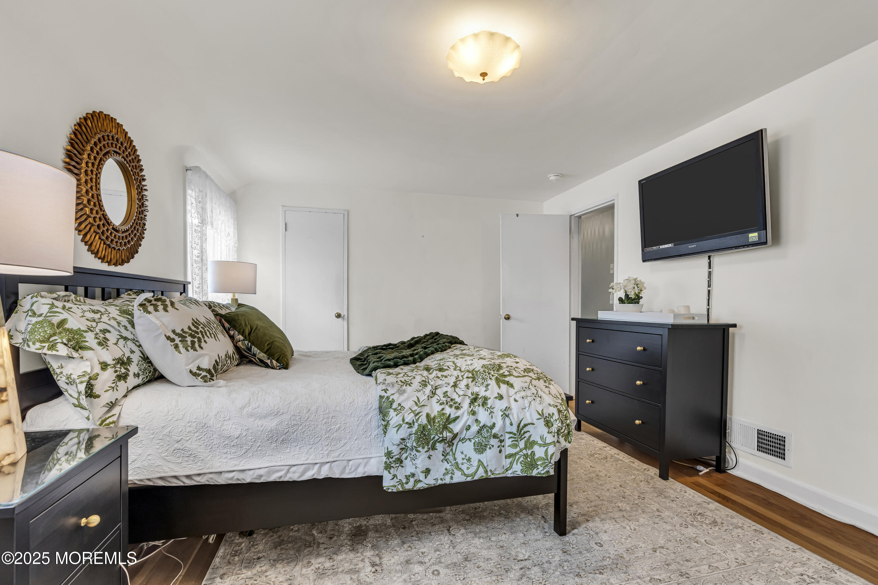 82 Ridge Road Fair Haven, NJ 07704 - Photo 23 of 39 a living room with furniture and a flat screen tv