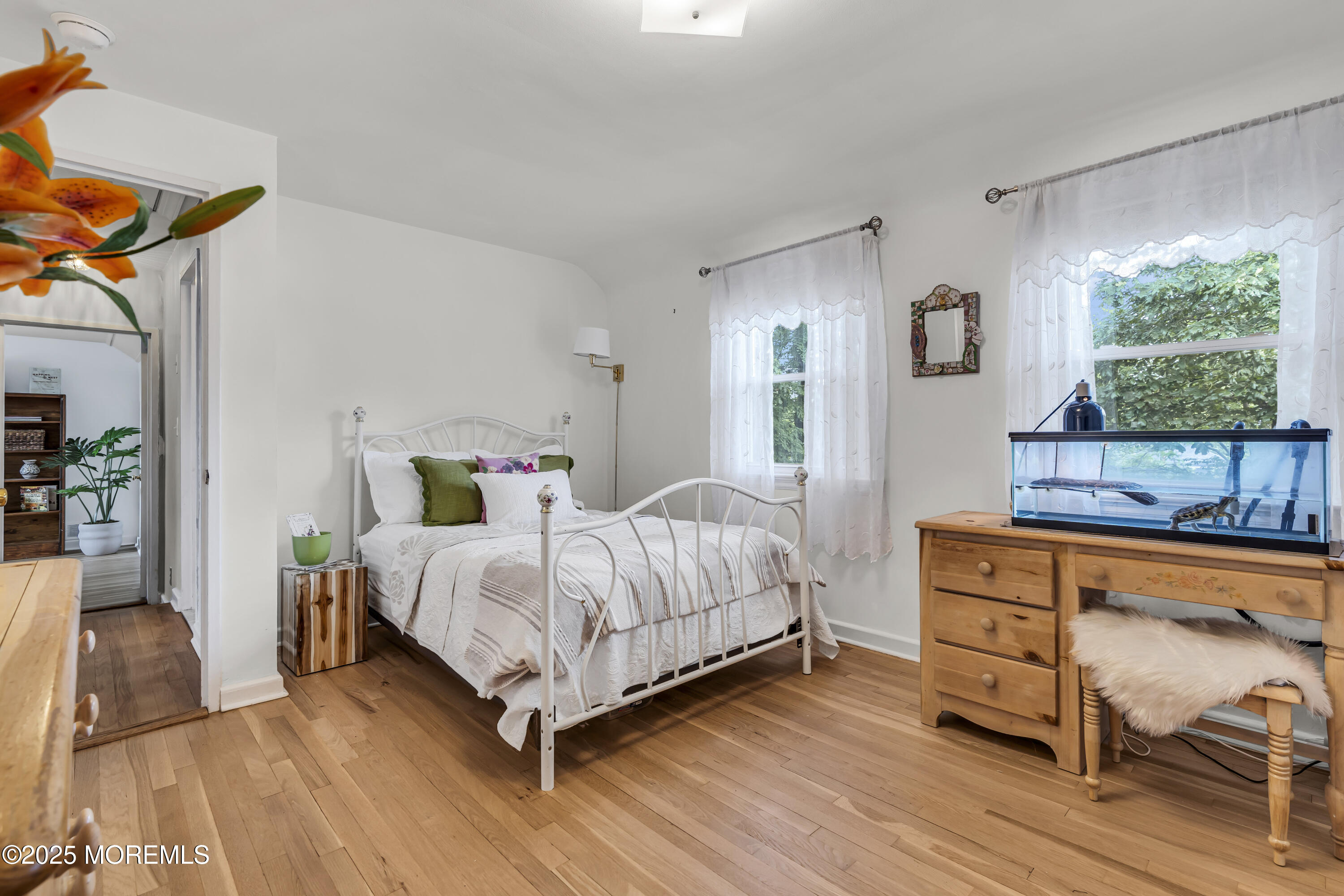 82 Ridge Road Fair Haven, NJ 07704 - Photo 27 of 39 a bedroom with a bed and a dresser next to a window