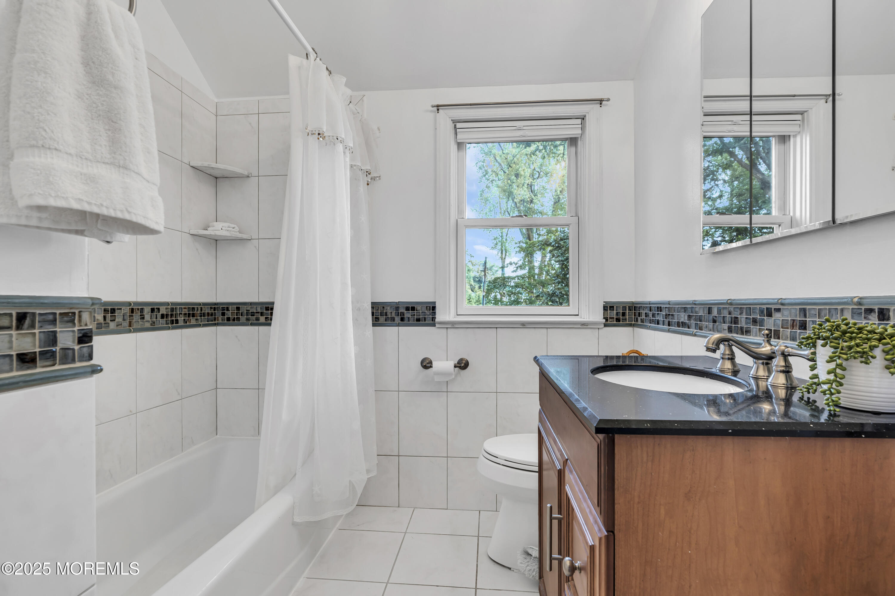 82 Ridge Road Fair Haven, NJ 07704 - Photo 30 of 39 a bathroom with a sink and a bathtub