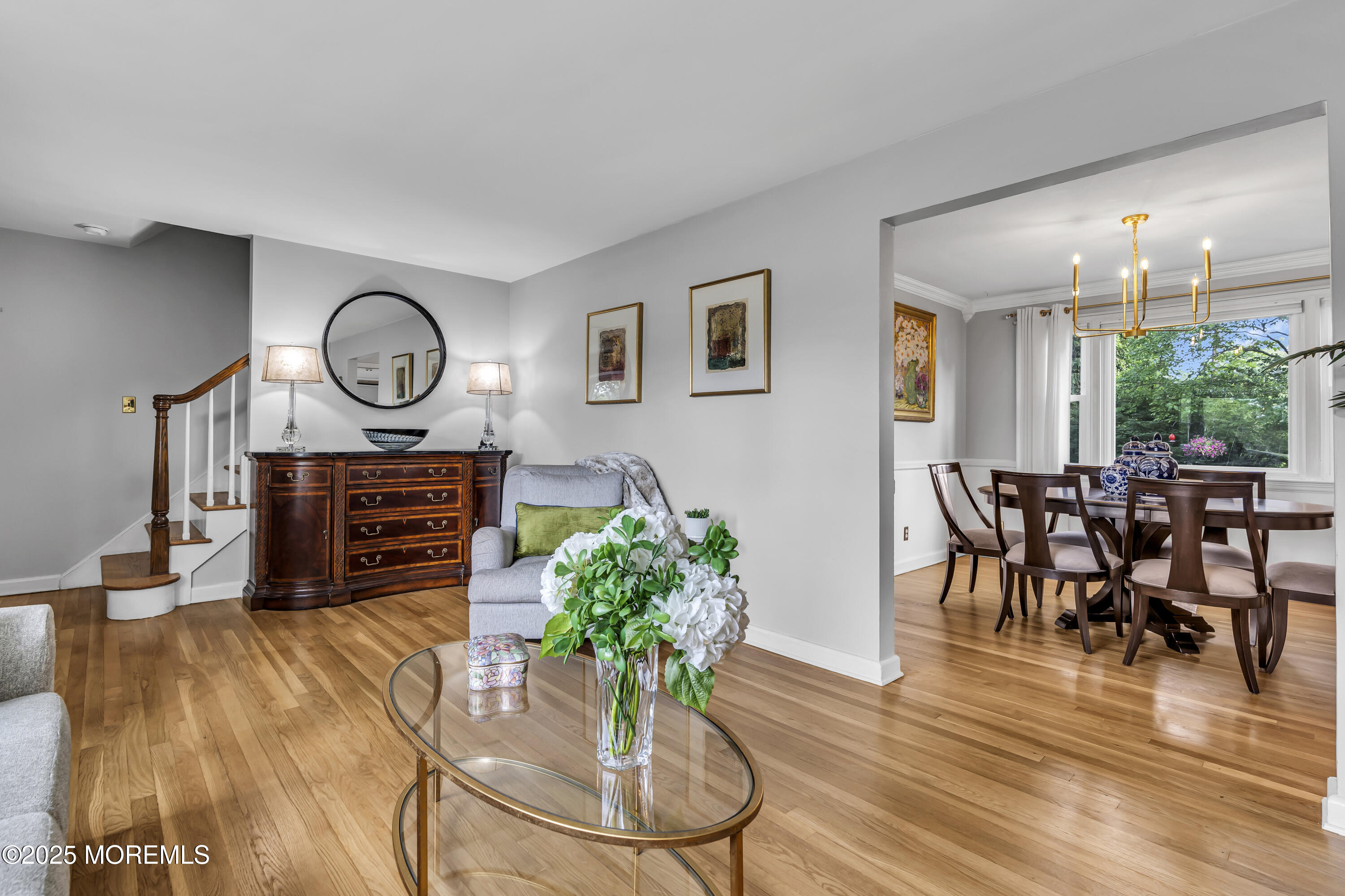 82 Ridge Road Fair Haven, NJ 07704 - Photo 3 of 39 a living room with couches chairs and kitchen view with wooden floor