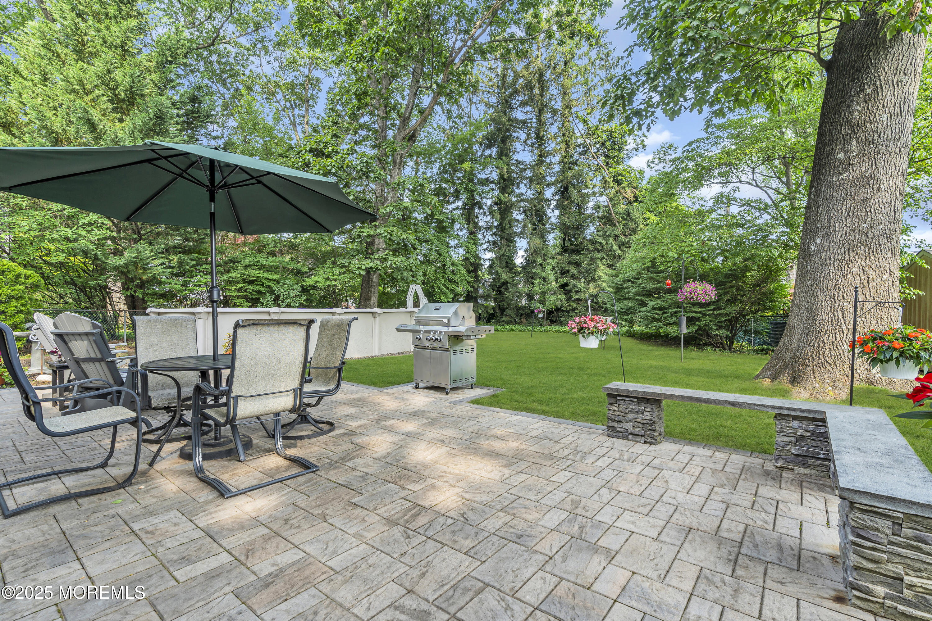 82 Ridge Road Fair Haven, NJ 07704 - Photo 34 of 39 a view of a chair and table on the garden