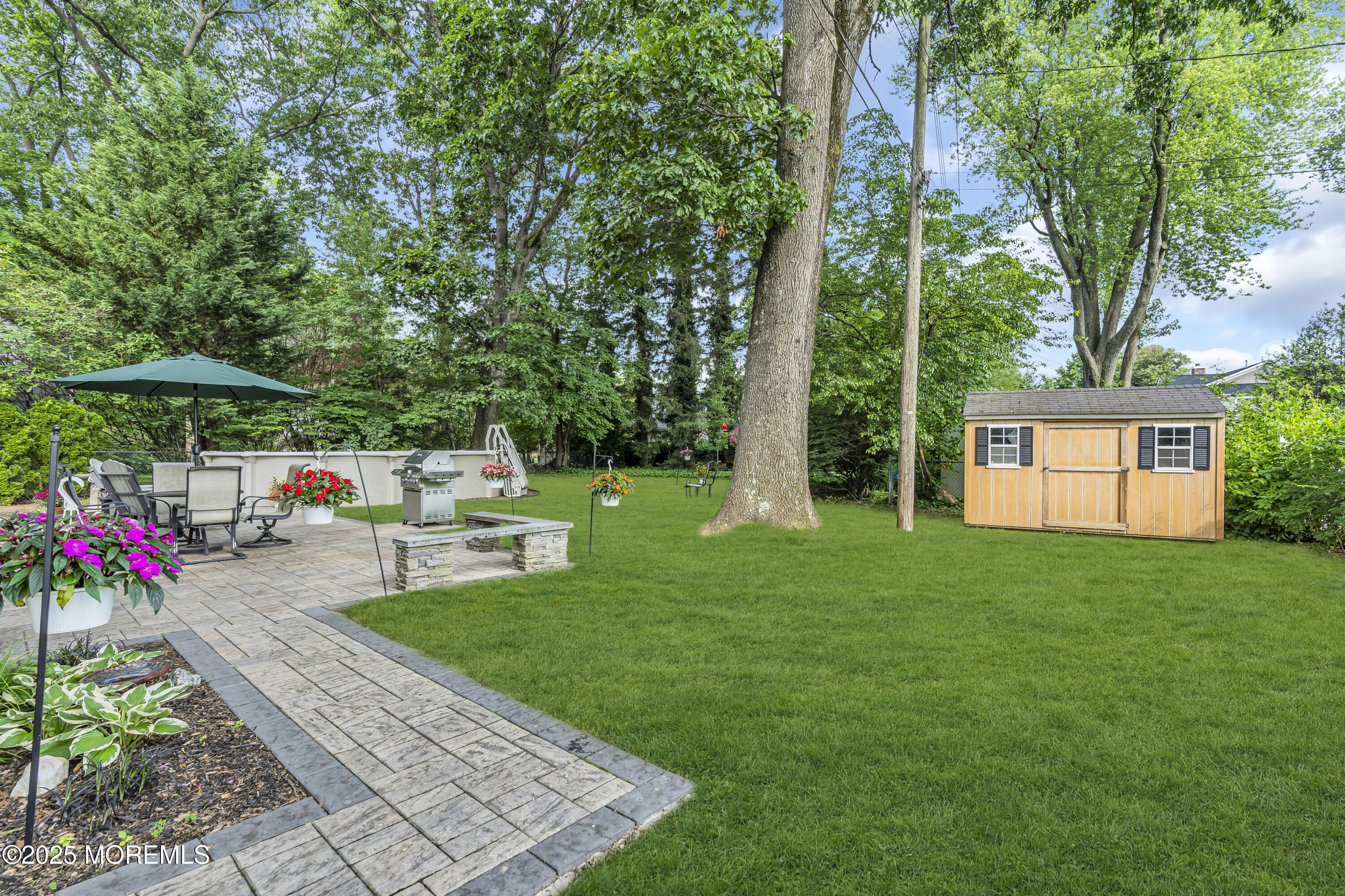 82 Ridge Road Fair Haven, NJ 07704 - Photo 35 of 39 a view of a backyard with sitting area