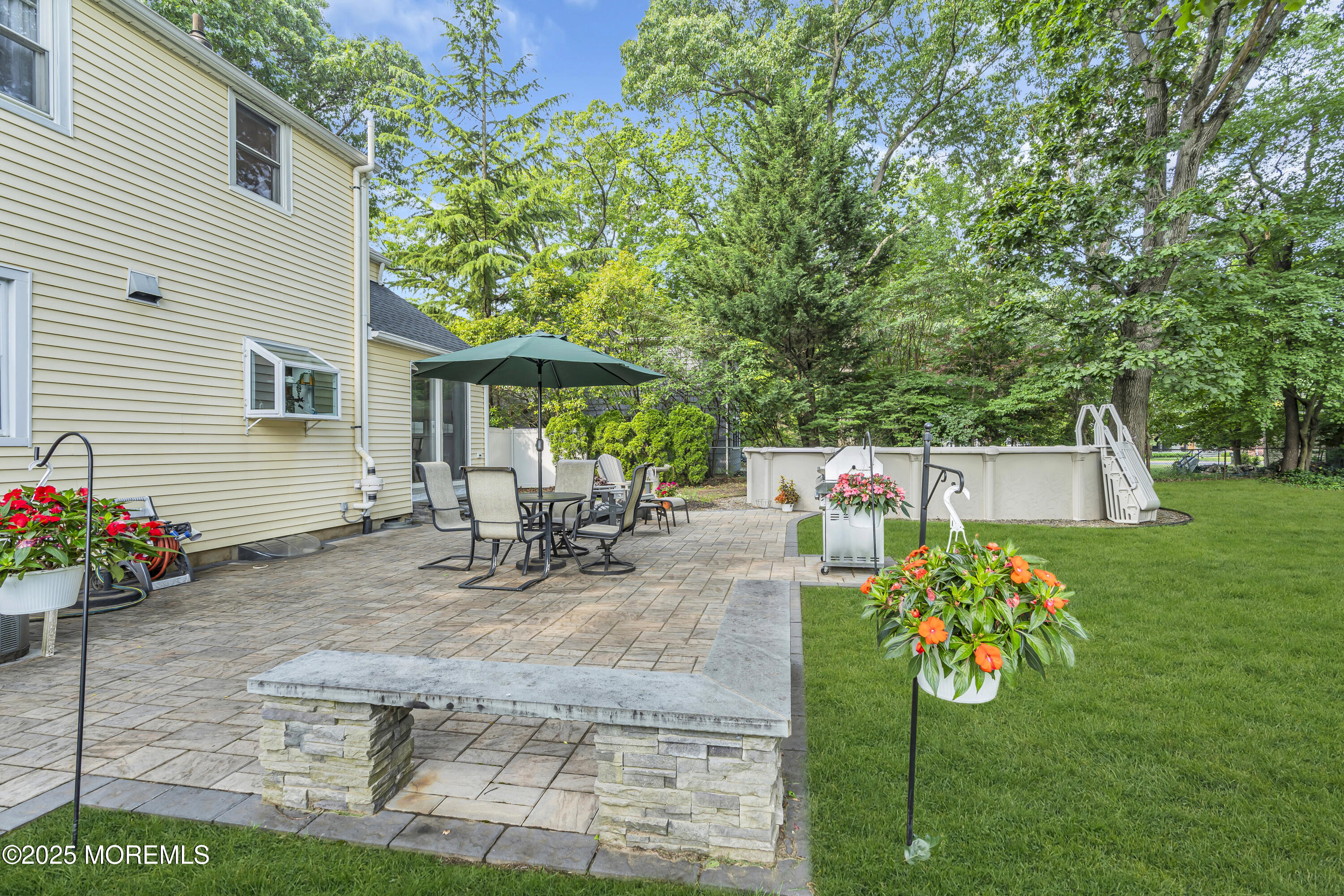 82 Ridge Road Fair Haven, NJ 07704 - Photo 37 of 39 a view of a dinning table and chairs in patio