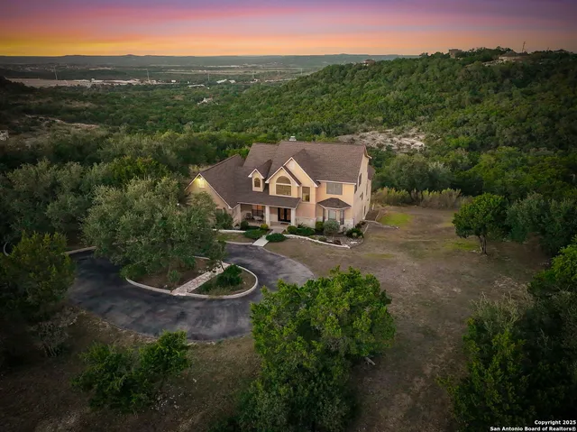 a aerial view of a house with a yard