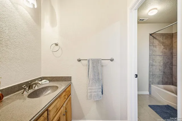 a kitchen with stainless steel appliances granite countertop a refrigerator and cabinets