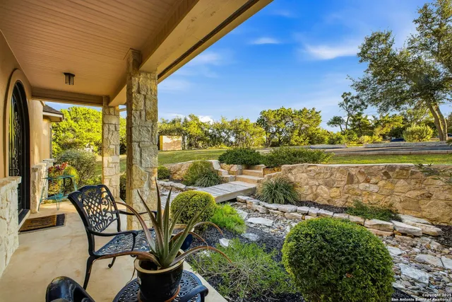 a view of a chairs and table in patio