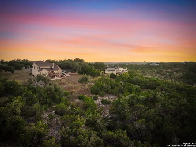 a view of a mountain in the distance in a field