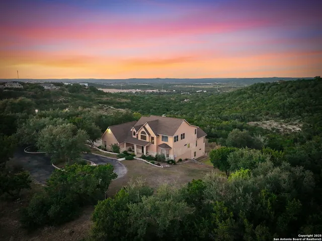 a view of a patio with table and chairs