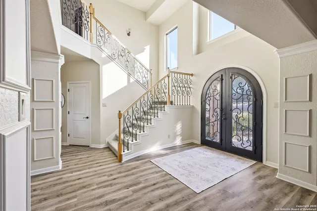 a view of an entryway with wooden floor