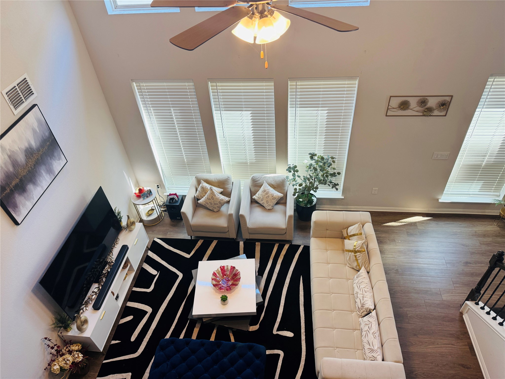 349 Rend Drive Leander, TX 78641 - Photo 2 of 21 Living room featuring dark wood finished floors, a ceiling fan, and a high ceiling