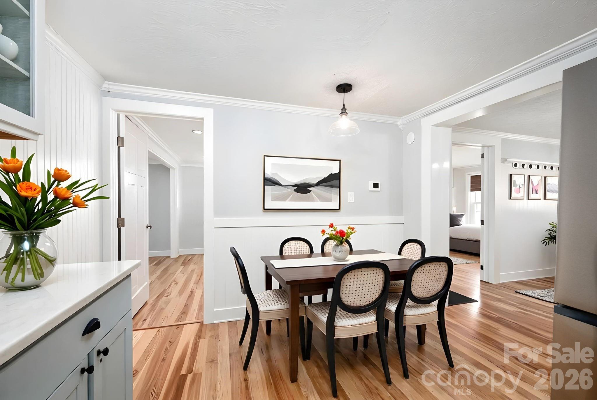 127 Shelburne Road Asheville, NC 28806 - Photo 14 of 28 a view of a a dining room with furniture window and wooden floor