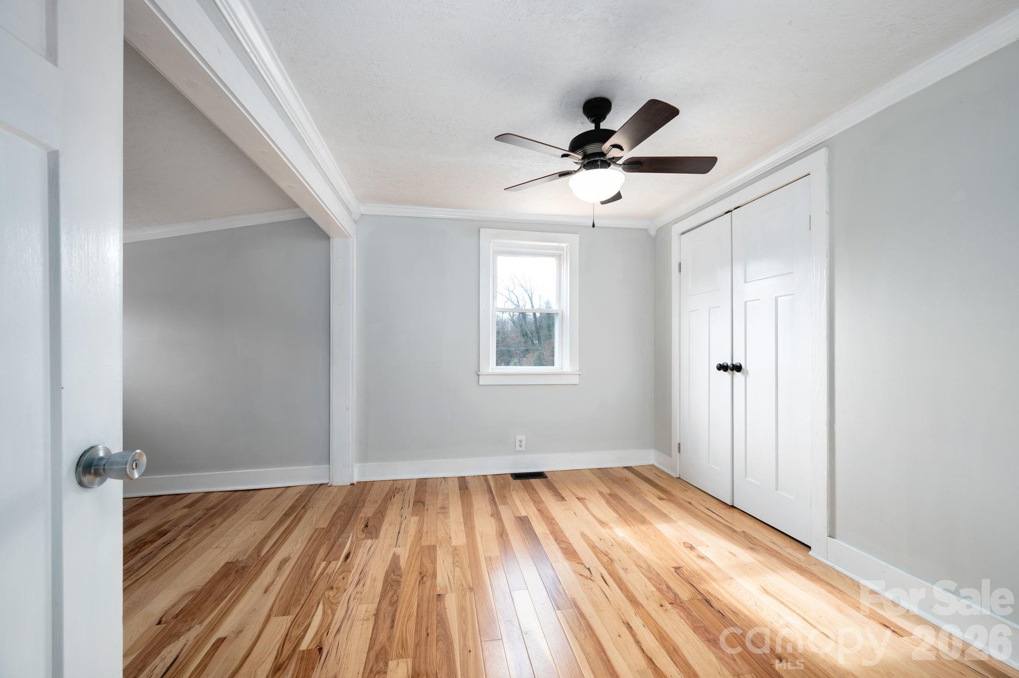 127 Shelburne Road Asheville, NC 28806 - Photo 15 of 28 a view of empty room with wooden floor and fan
