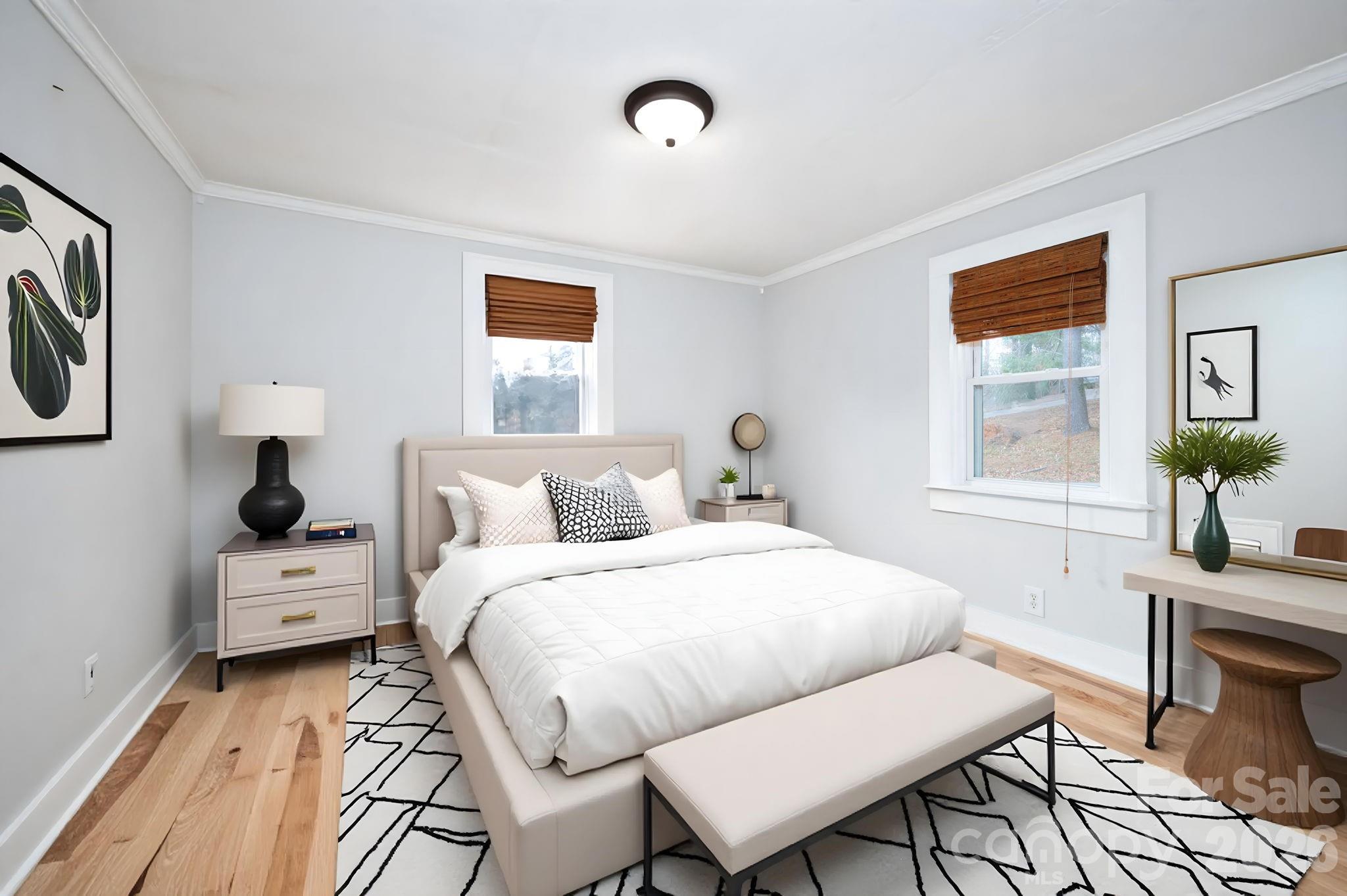 127 Shelburne Road Asheville, NC 28806 - Photo 21 of 28 a bedroom with a bed and a table in it