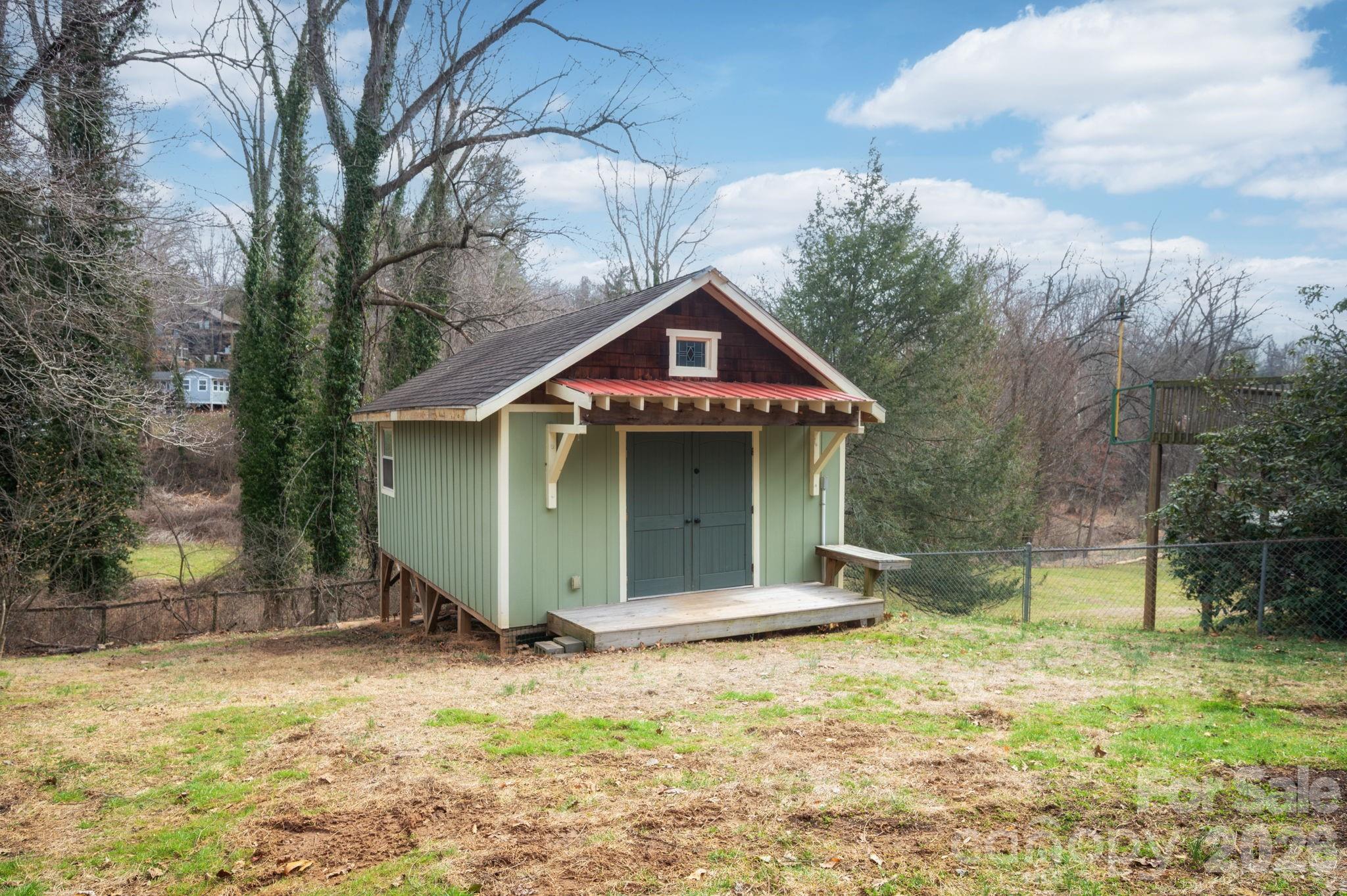 127 Shelburne Road Asheville, NC 28806 - Photo 24 of 28 a front view of a house with garden