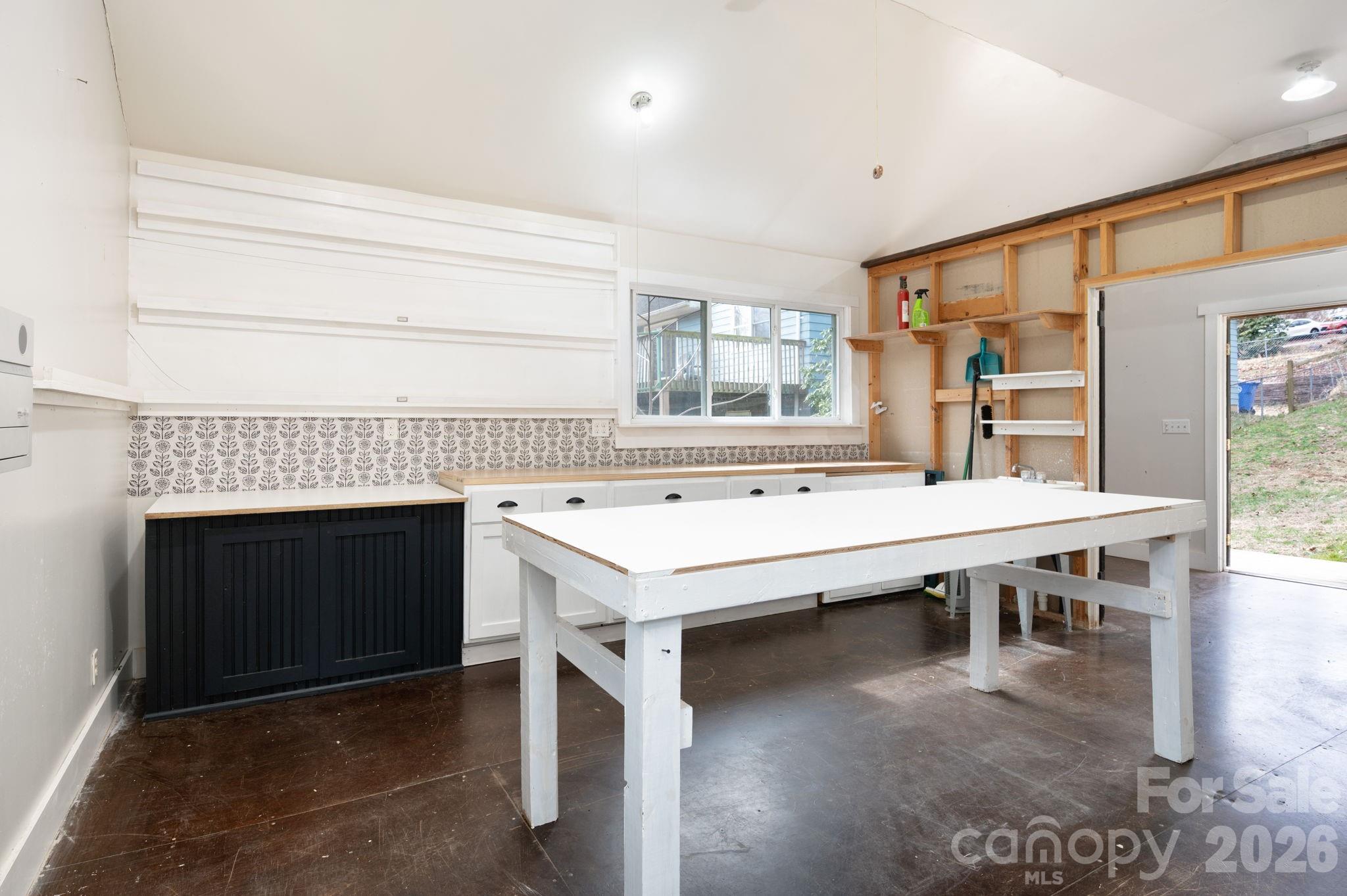 127 Shelburne Road Asheville, NC 28806 - Photo 26 of 28 a kitchen with a stove and a refrigerator