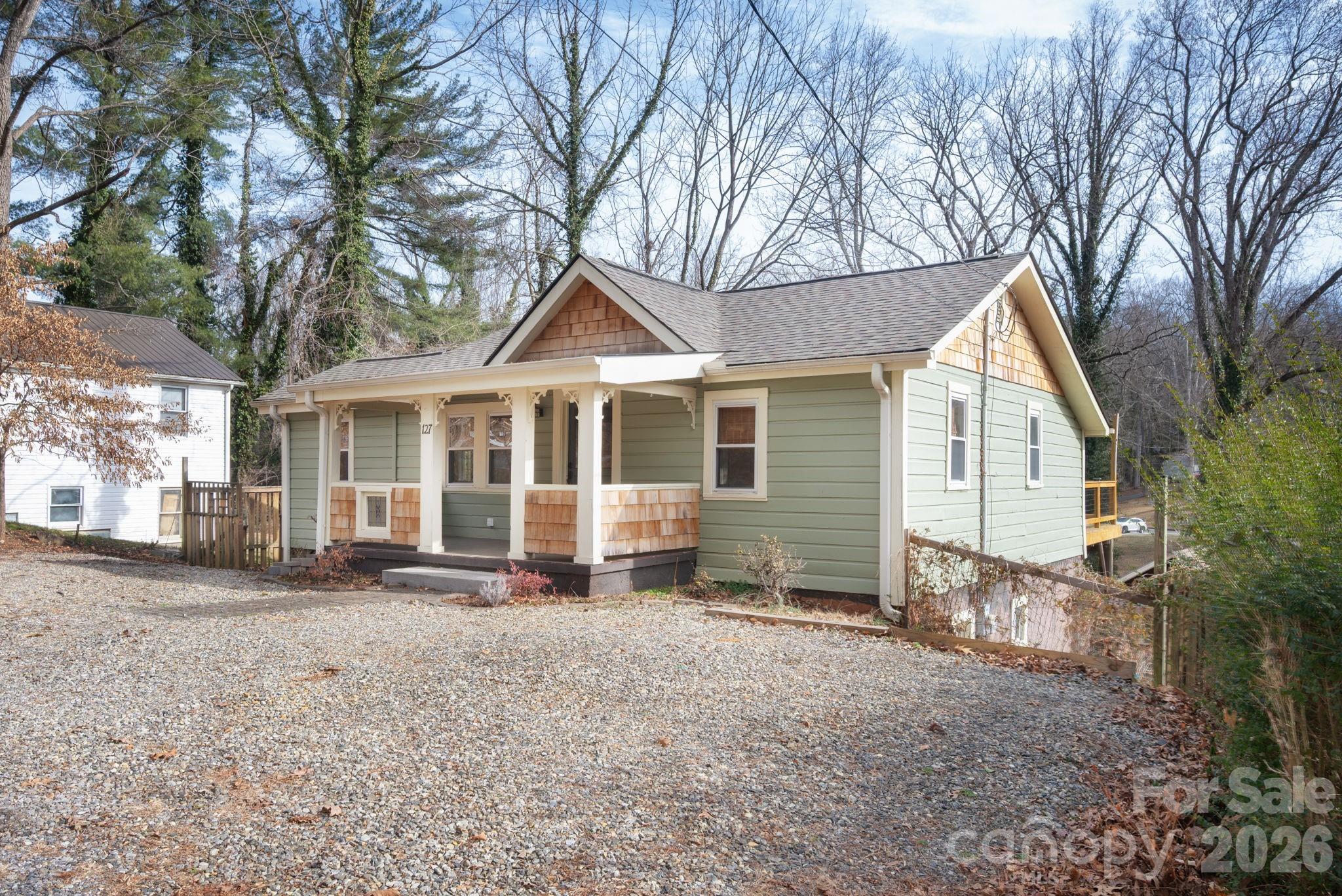 127 Shelburne Road Asheville, NC 28806 - Photo 3 of 28 a front view of a house with a yard