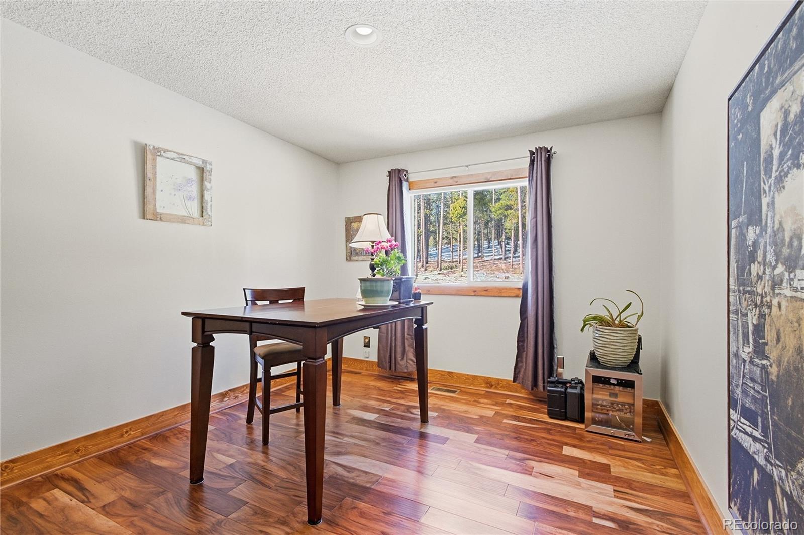 8790 South Warhawk Road Conifer, CO 80433 - Photo 16 of 41 a workspace with furniture and window