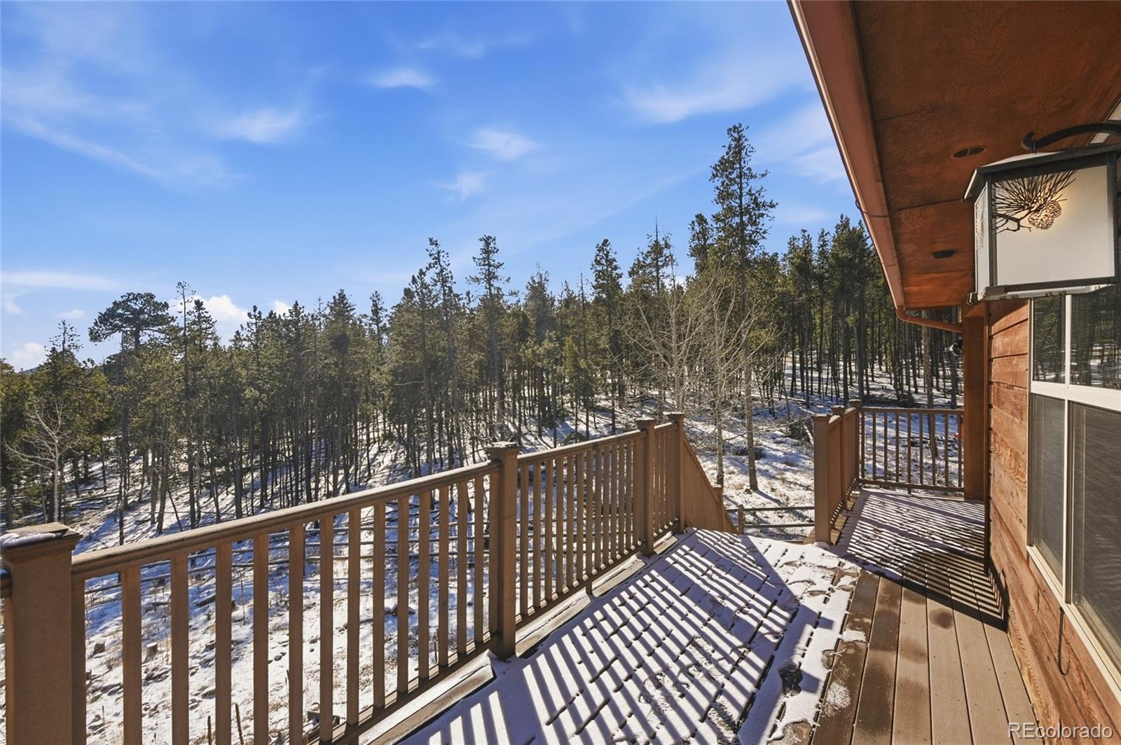 8790 South Warhawk Road Conifer, CO 80433 - Photo 29 of 41 a view of city from a balcony