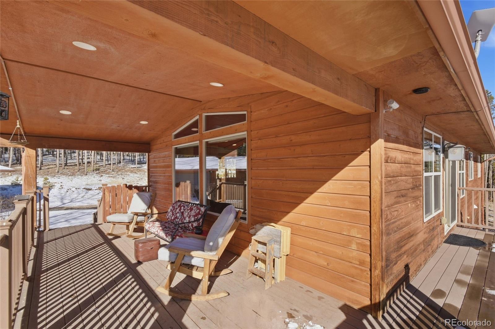 8790 South Warhawk Road Conifer, CO 80433 - Photo 31 of 41 a view of a balcony with chairs