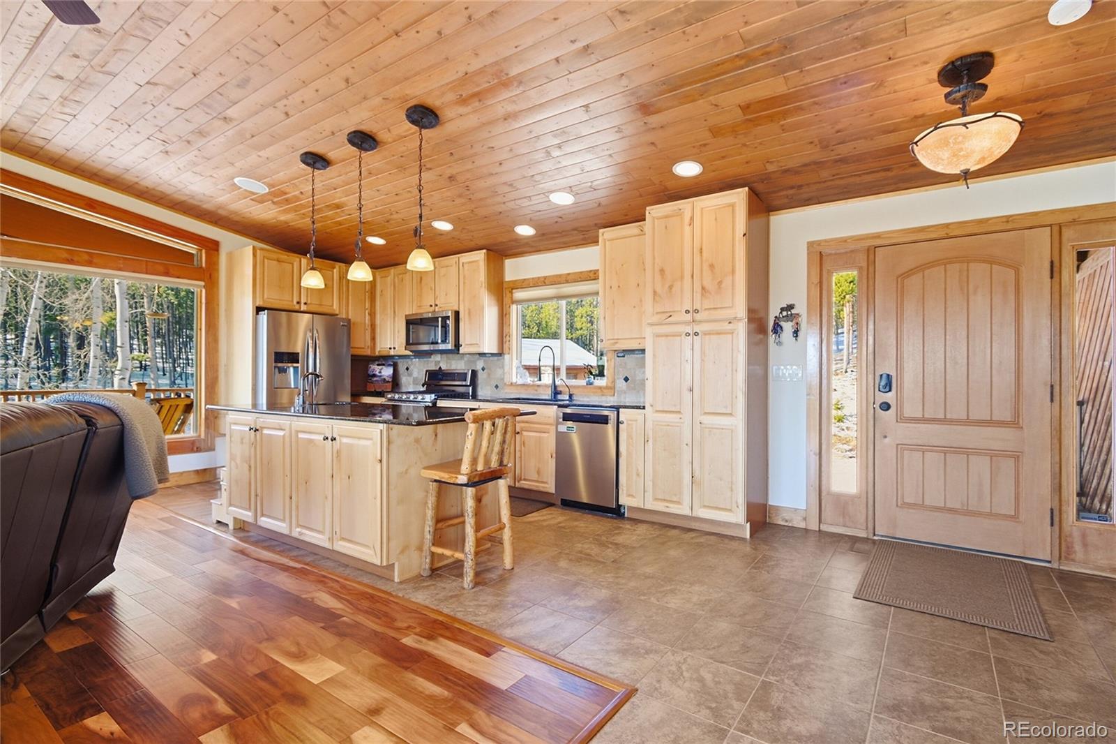 8790 South Warhawk Road Conifer, CO 80433 - Photo 5 of 41 a view of kitchen with furniture and refrigerator