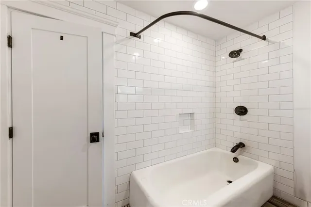 a living room with furniture pool table and a glass door