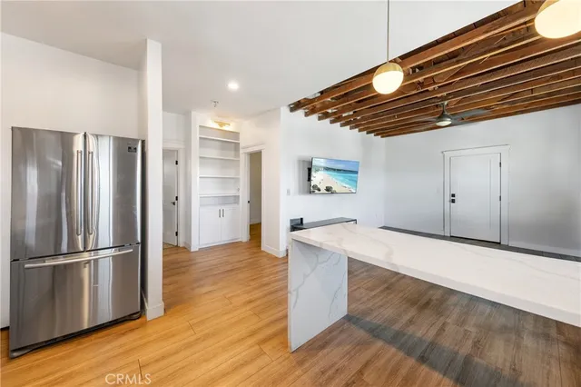 a view of livingroom with furniture and workspace