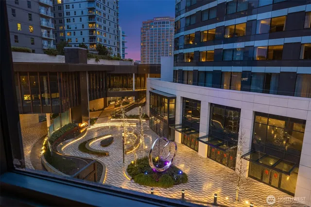 a kitchen with a sink cabinets and wooden floor