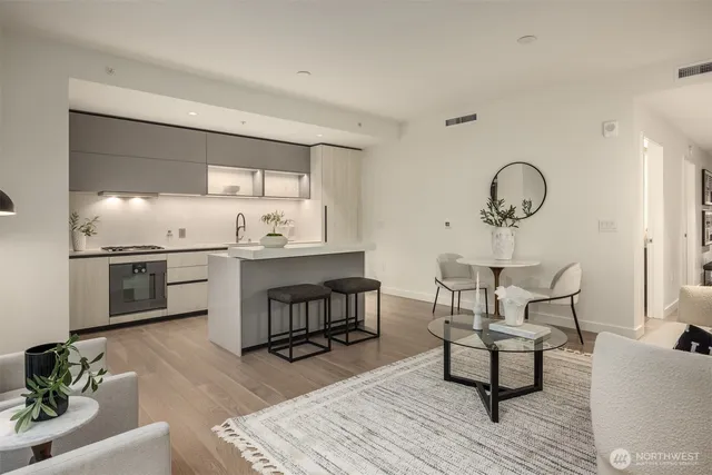 a kitchen with a sink cabinets and stainless steel appliances