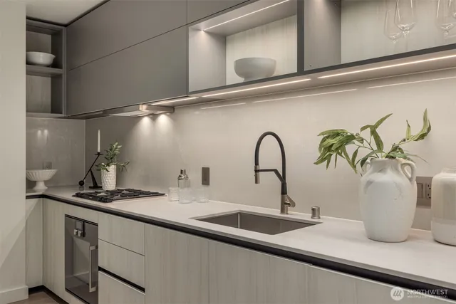 a bedroom with a bed and a night stand