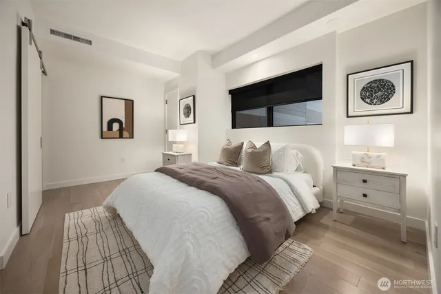 a bathroom with a shower sink and mirror
