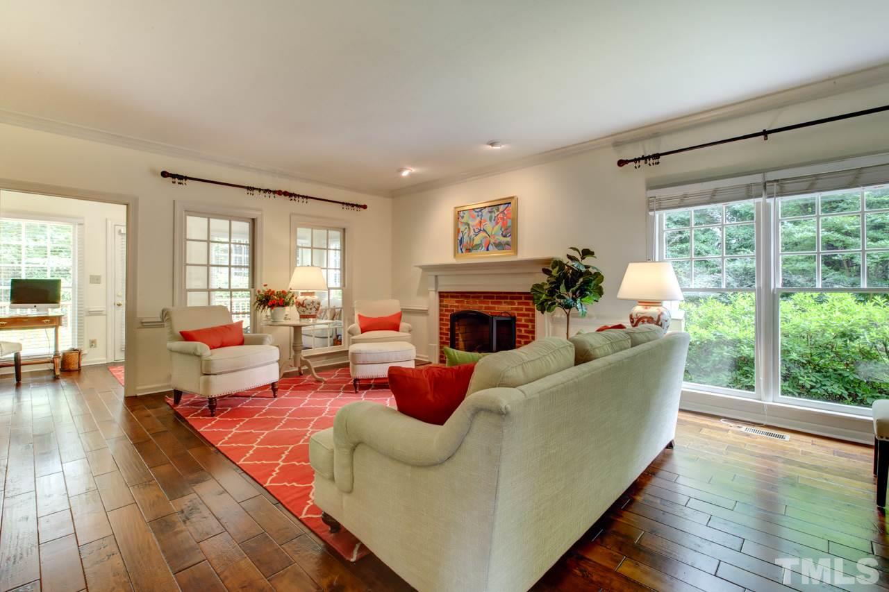 407 Weathergreen Drive Raleigh, NC 27615 - Photo 6 of 14 Large and bright living area with gorgeous mahogany floors.