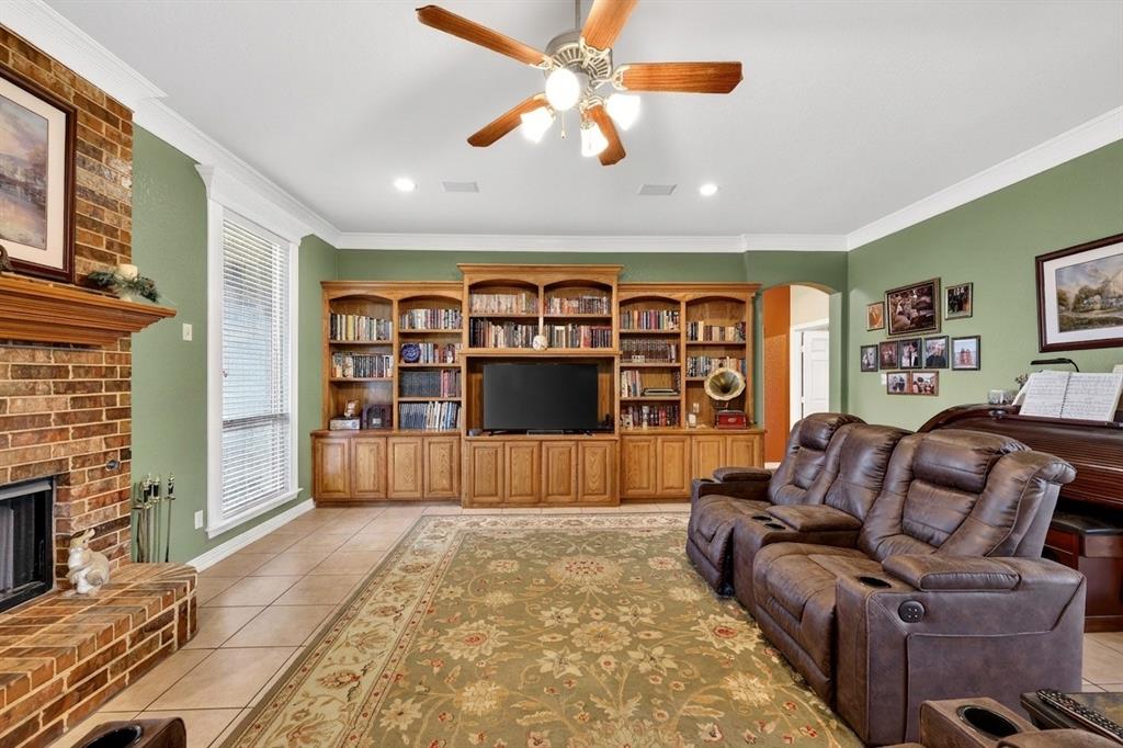 1035 Highland Road Cleburne, TX 76033 - Photo 13 of 36 a living room with furniture and a flat screen tv