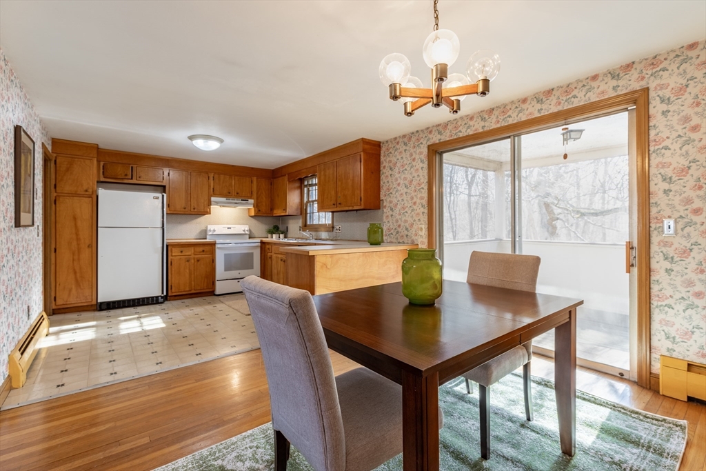 51 Eldred Street Lexington, MA 02420 - Photo 11 of 30 a view of a dining room with furniture window and wooden floor