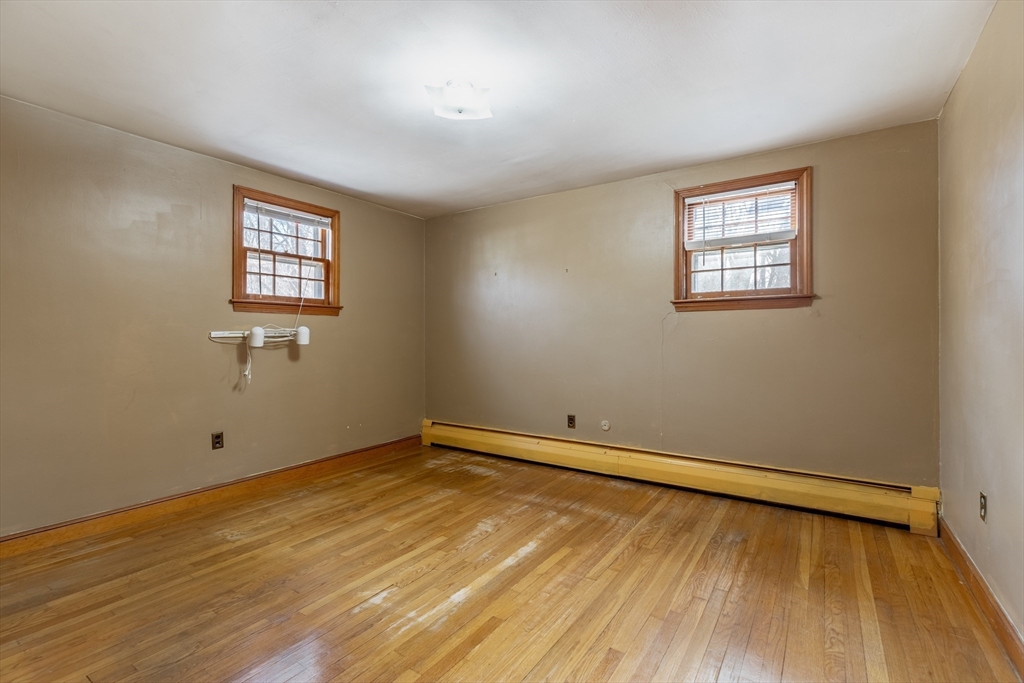 51 Eldred Street Lexington, MA 02420 - Photo 16 of 30 a view of a room with wooden floor and window